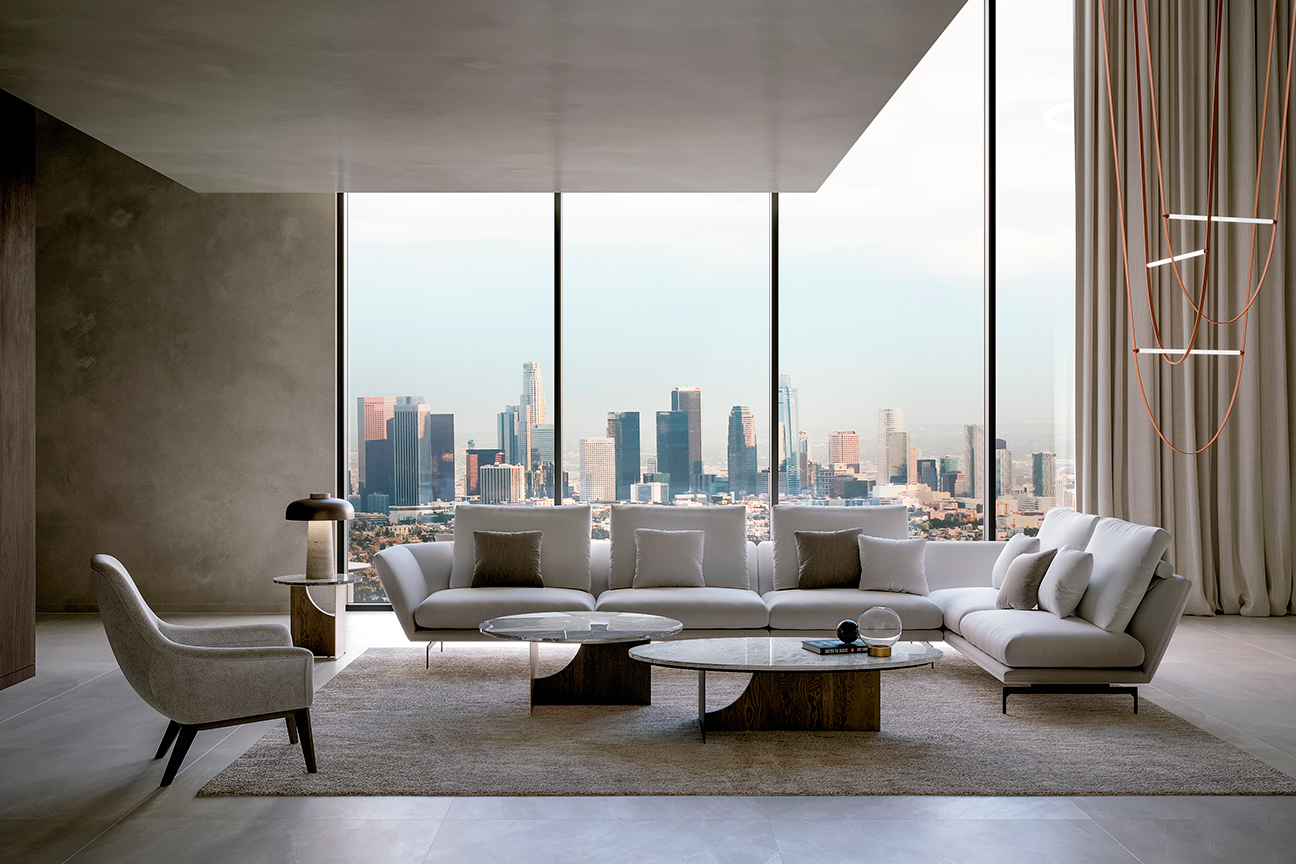 Modern grey living room with L-shaped modular sofa and original sculptural coffee tables.