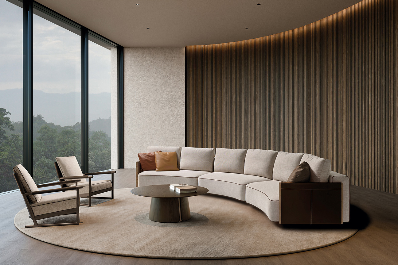 Isole living room featuring a curved sofa and premium finishes that enhance comfort and refined sophistication