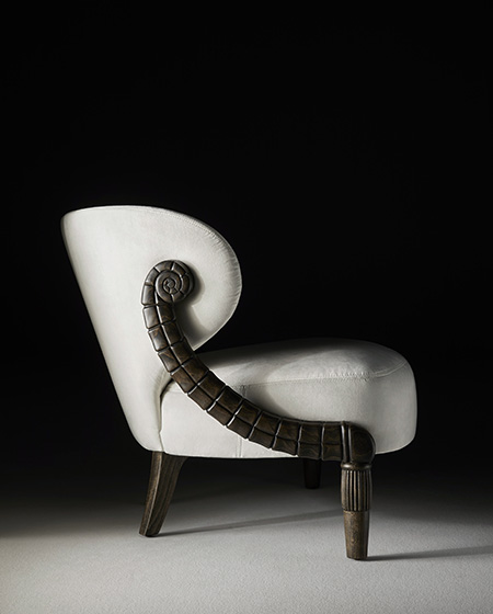 Montesa armchair handcrafted in carved wood with organic shapes and upholstered in white leather by Coleccion Alexandra.