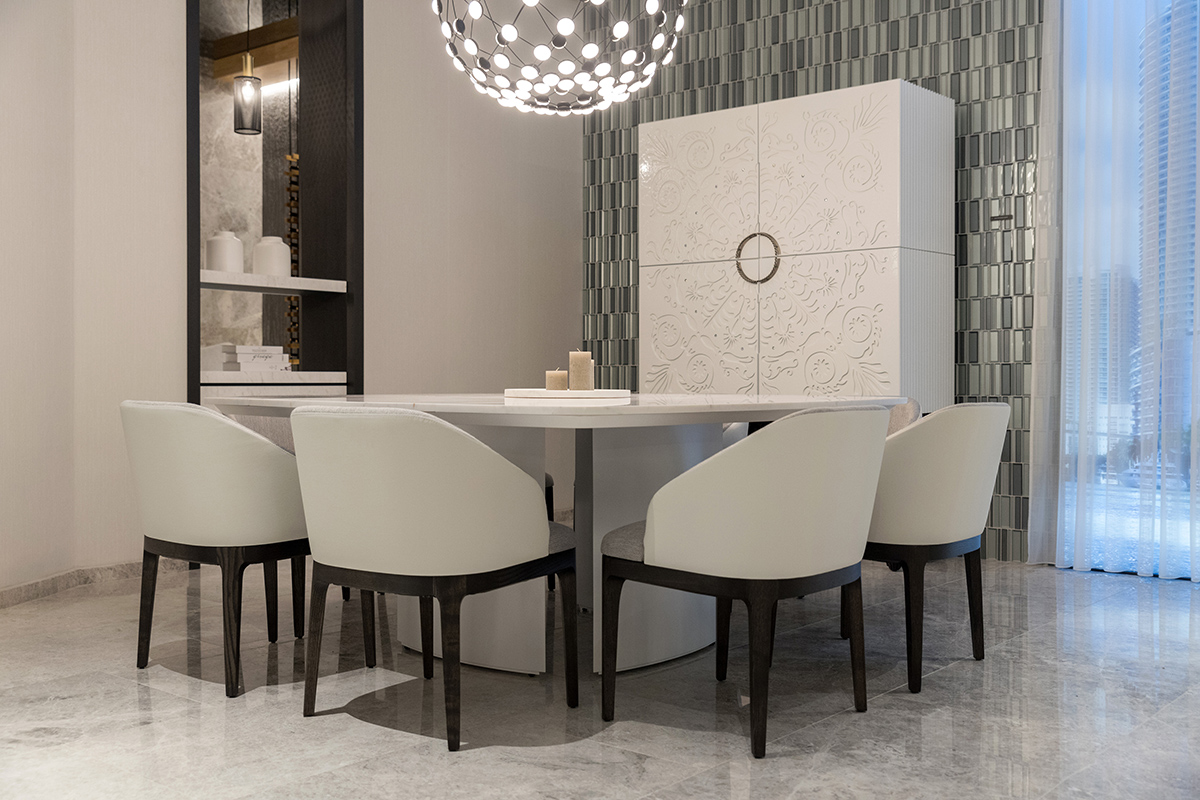 Contemporary white dining room with classic Alexandra cabinet and modern Wind table made by Alexandra.