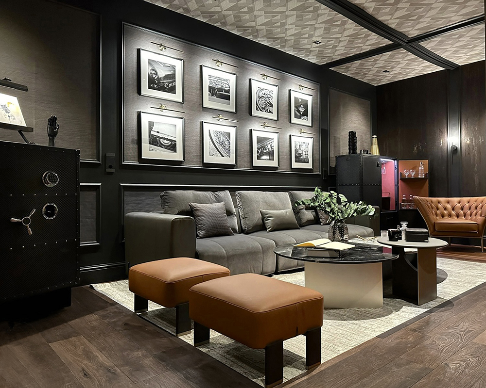 Velvet sofas and leather armchairs in dark tones create a sophisticated ambience.
