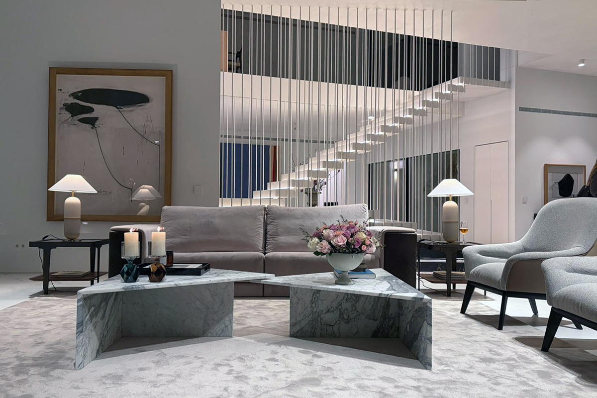 Dining area with sofa and armchairs by Alexandra in a luxury home staging project with elegant and refined design by The Hamptons